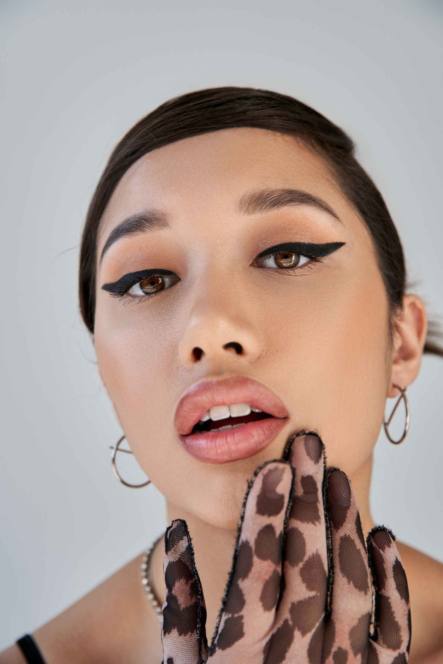 close up portrait of charming asian woman with seductive gaze ho